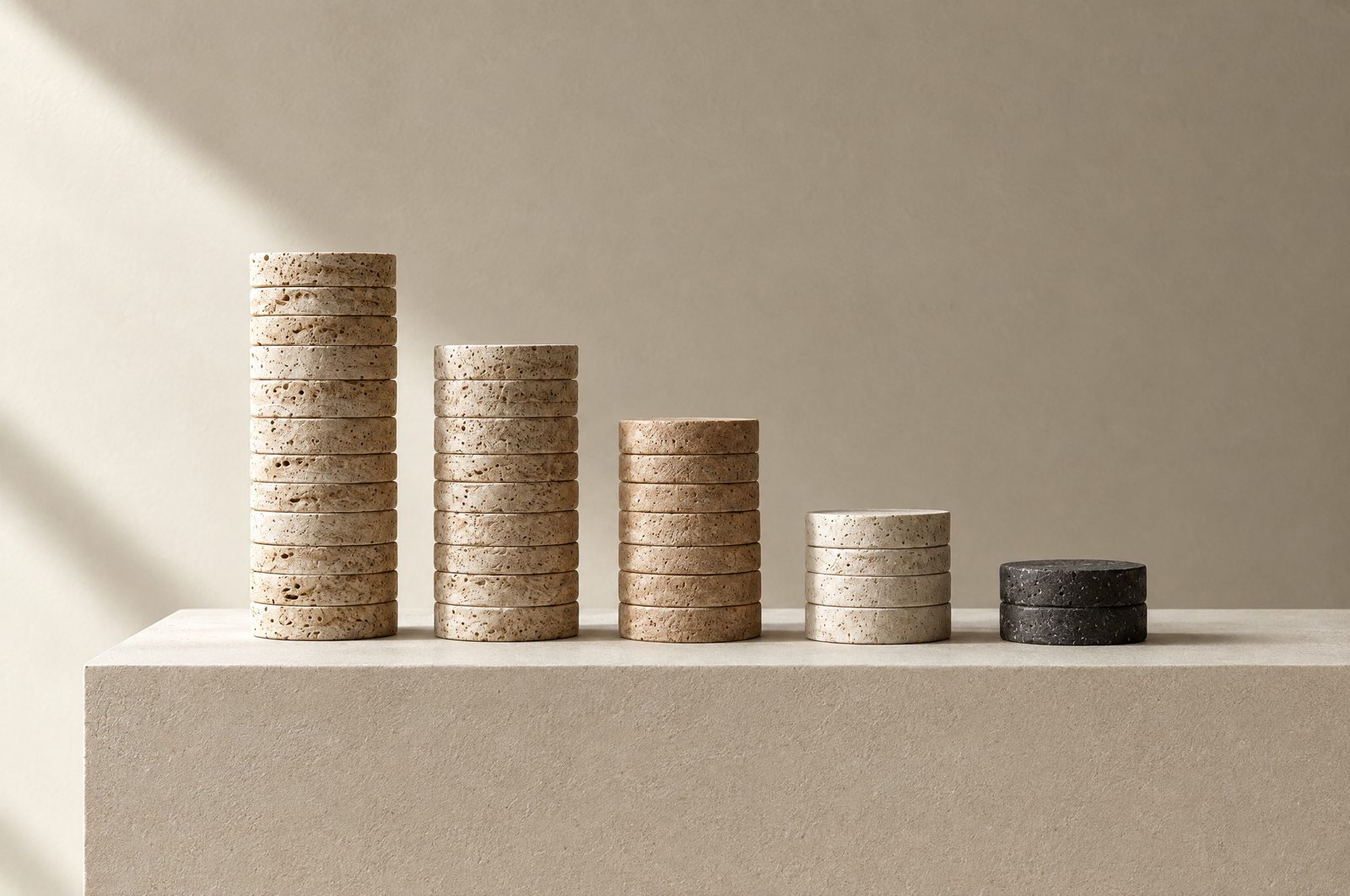 Travertine discs stacked in columns of descending height